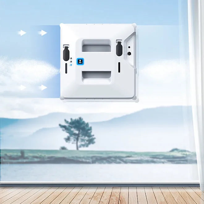 White intelligent small window cleaner robot on smooth indoor glass surface with plastic body