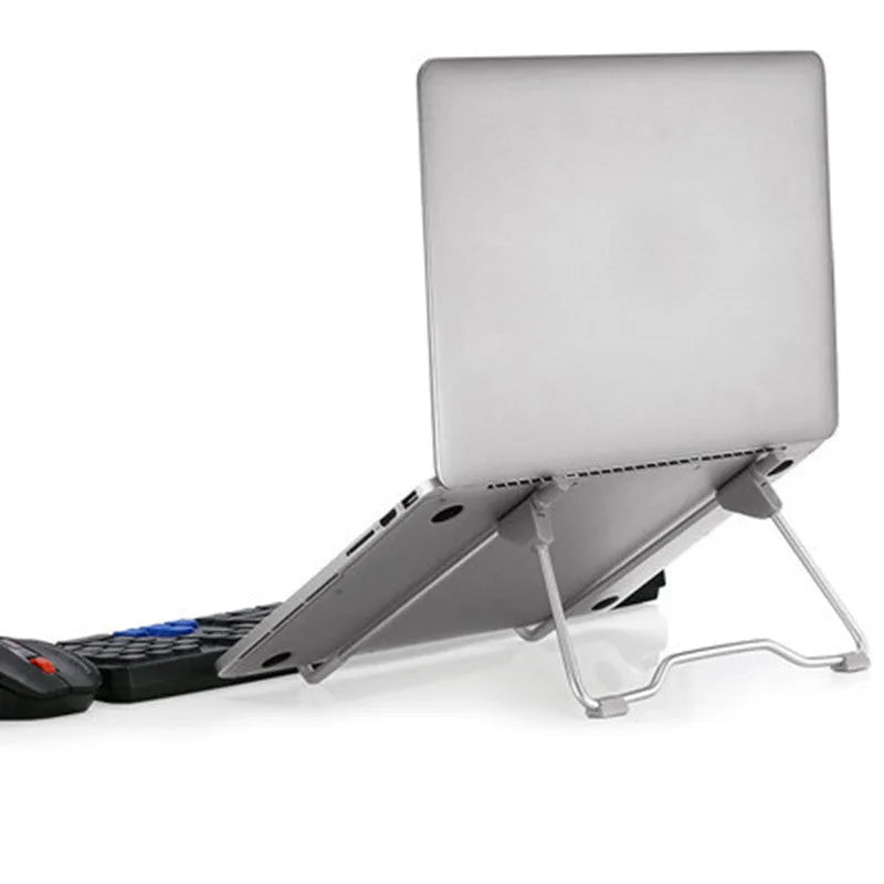 Grey aluminium alloy and engineering plastic foldable mobile phone and laptop stand on a desk.