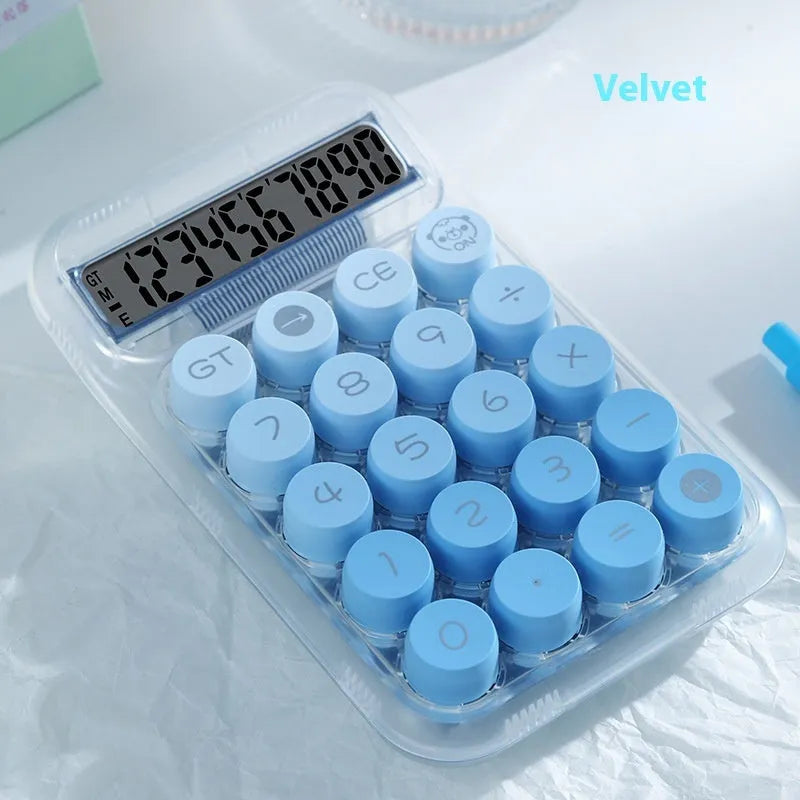 Gradient colour mechanical keyboard calculator on a desk showing LCD display.