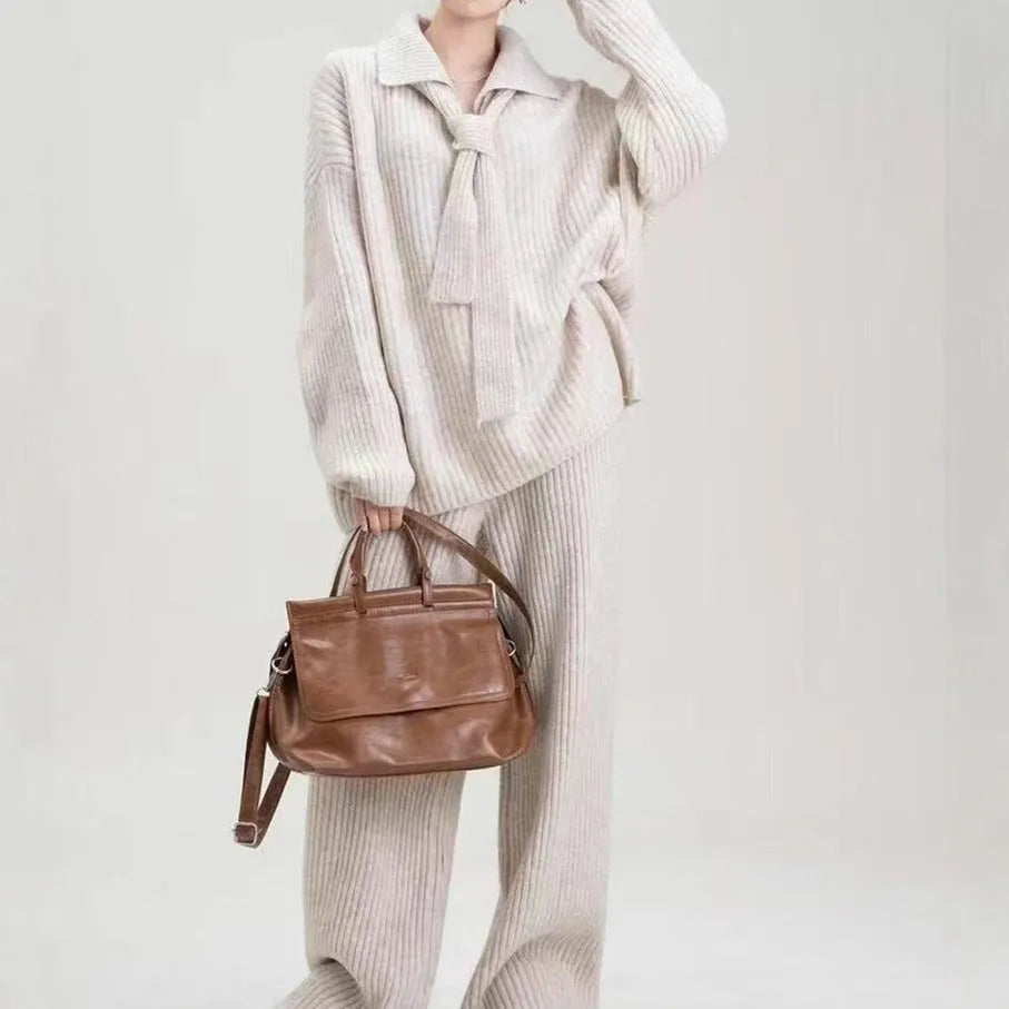 Acrylic knit sweater suit two-piece set showing top and trousers in beige colour