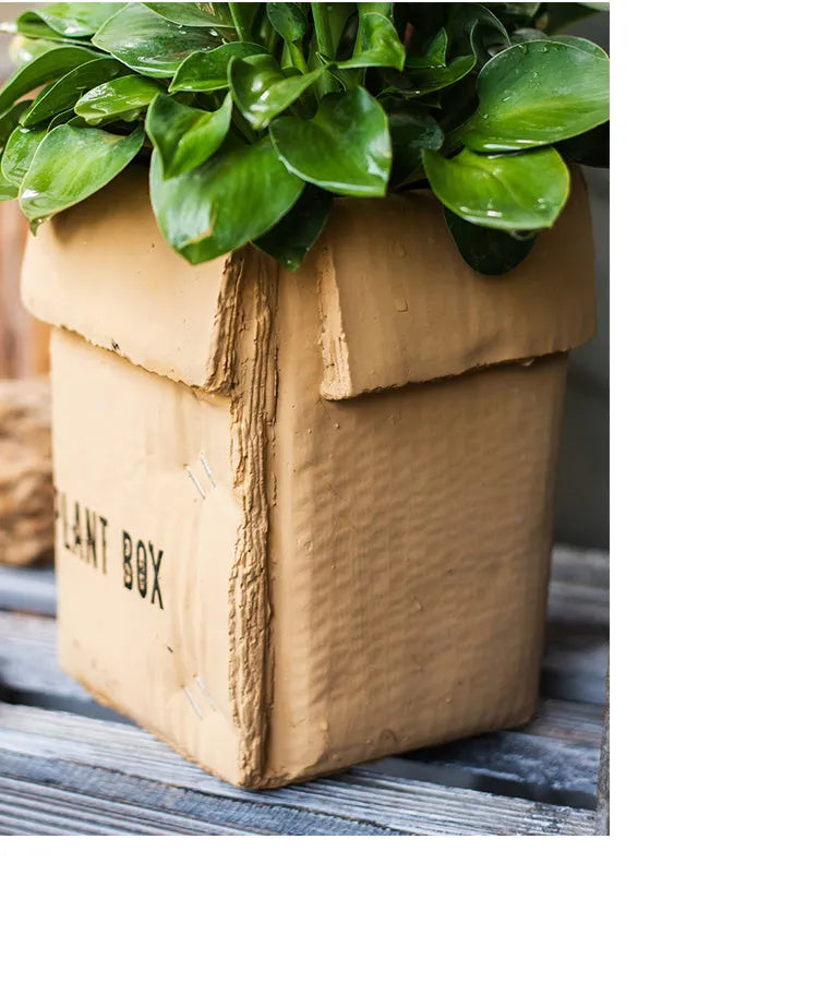 Cement brown paper box style flowerpot with bottom drainage holes for indoor planting