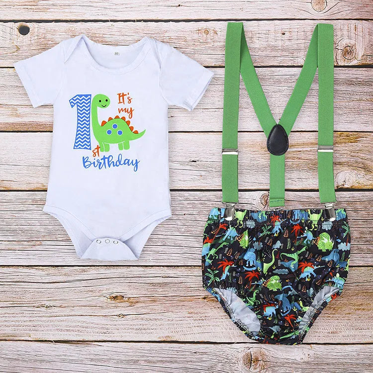 Baby in a soft cotton dinosaur print romper with shorts, showing the pullover design and clean finish.