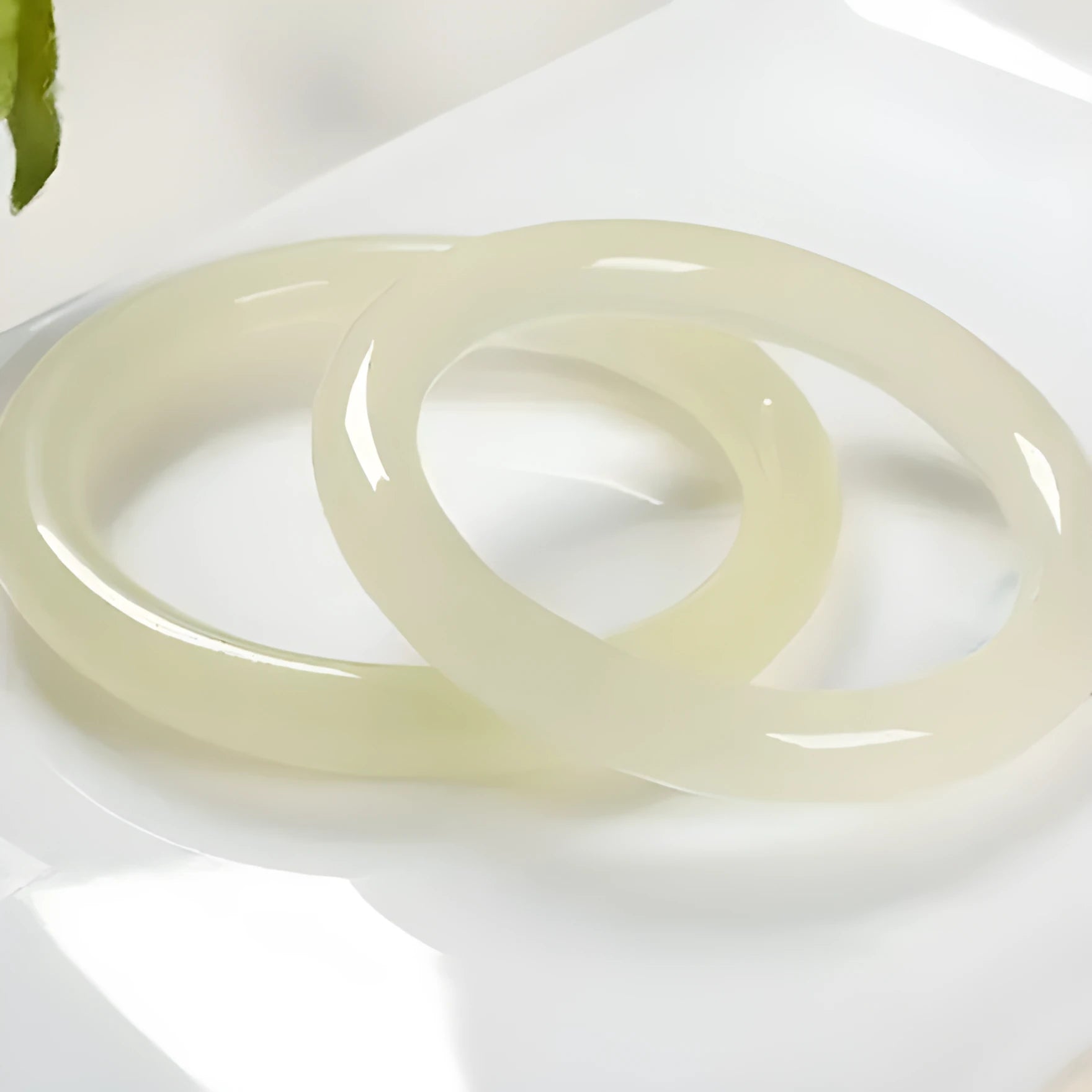 Adjustable winding bracelet made of round ice-like silk jade beads on a silk cord.