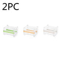 Fante plastic tape cutter storage box in beige with tape roll visible, compact Japanese-style design