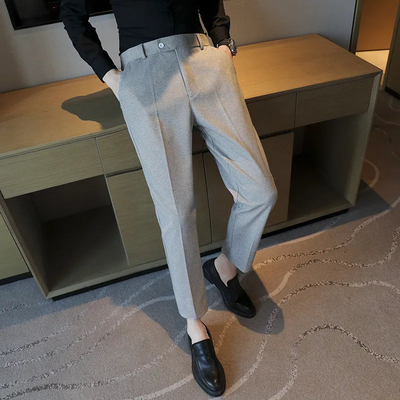 Straight retro brown corduroy trousers with elastic waistband on hanger