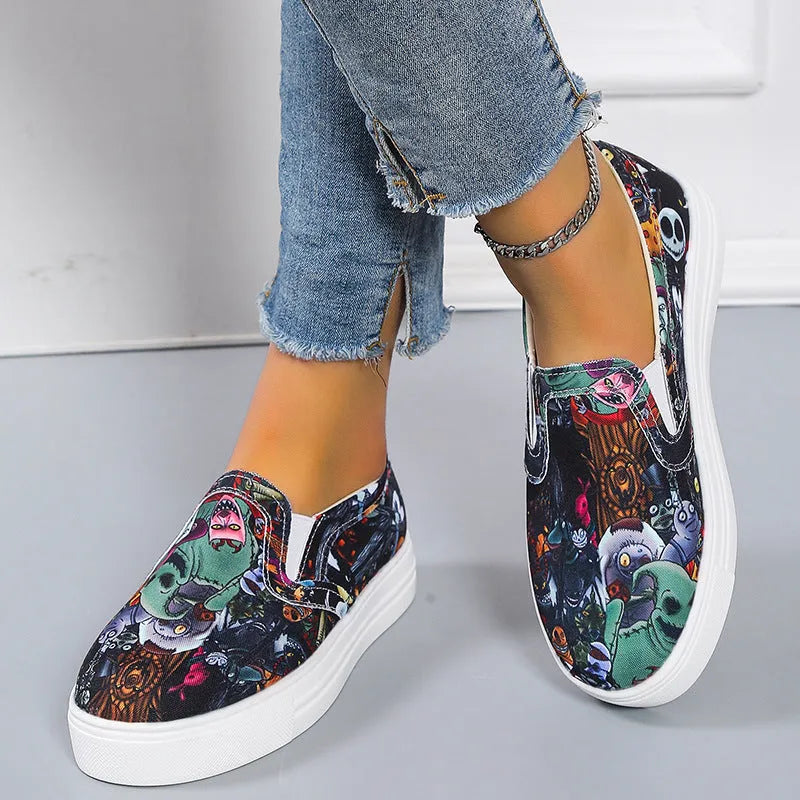 Women's blue low-top canvas sneaker with flat rubber sole on a plain background.