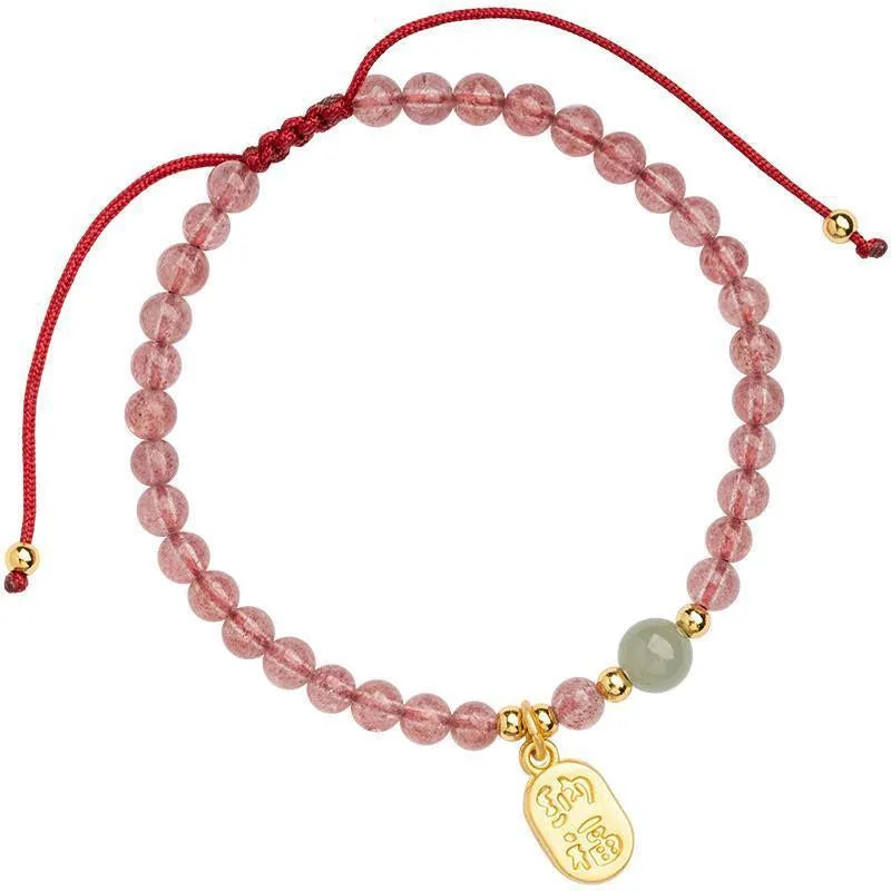 Hand-woven red rope bracelet with strawberry quartz crystal lucky charm