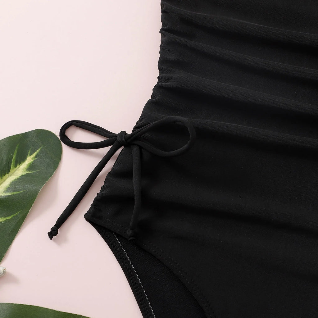 Black girls' swimsuit with pleated tie detail, briefs style, polyester spandex, sizes 130-160