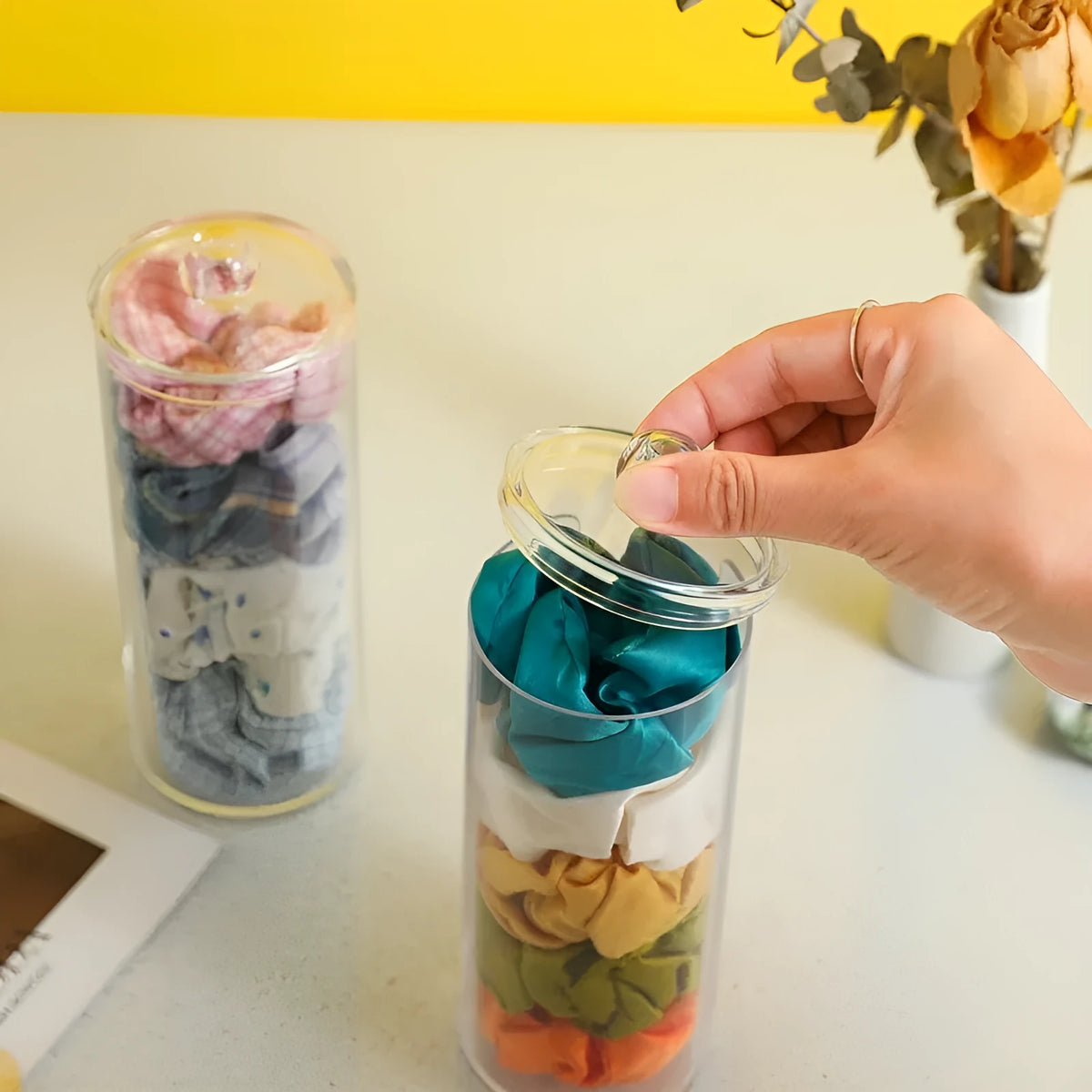 Transparent PE plastic pull-out storage box with cover for hair rings, desktop organiser, modern minimalist style.