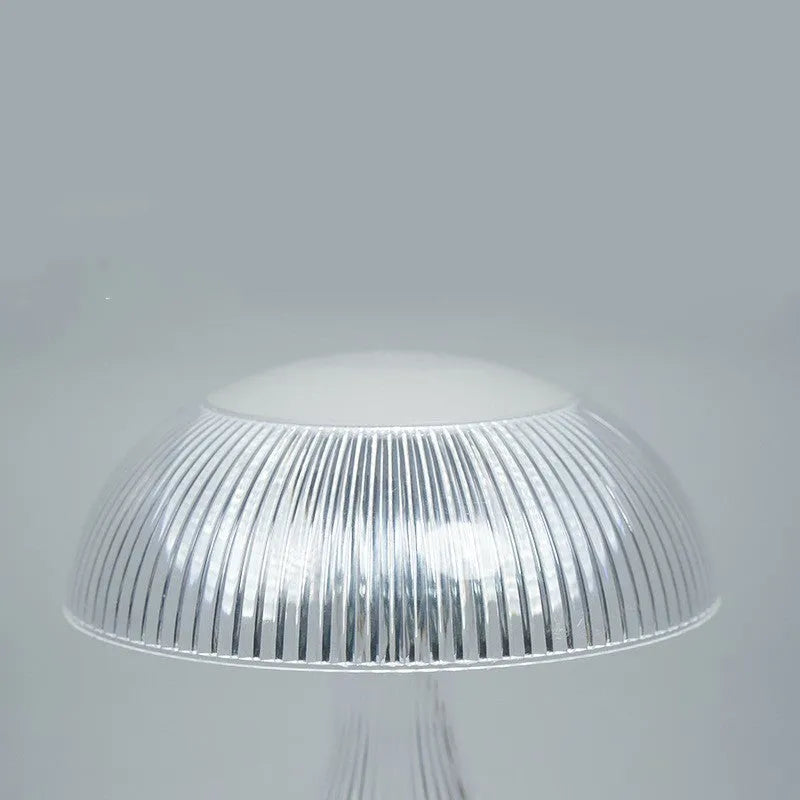 White three-colour changing USB rechargeable touch control night light on surface