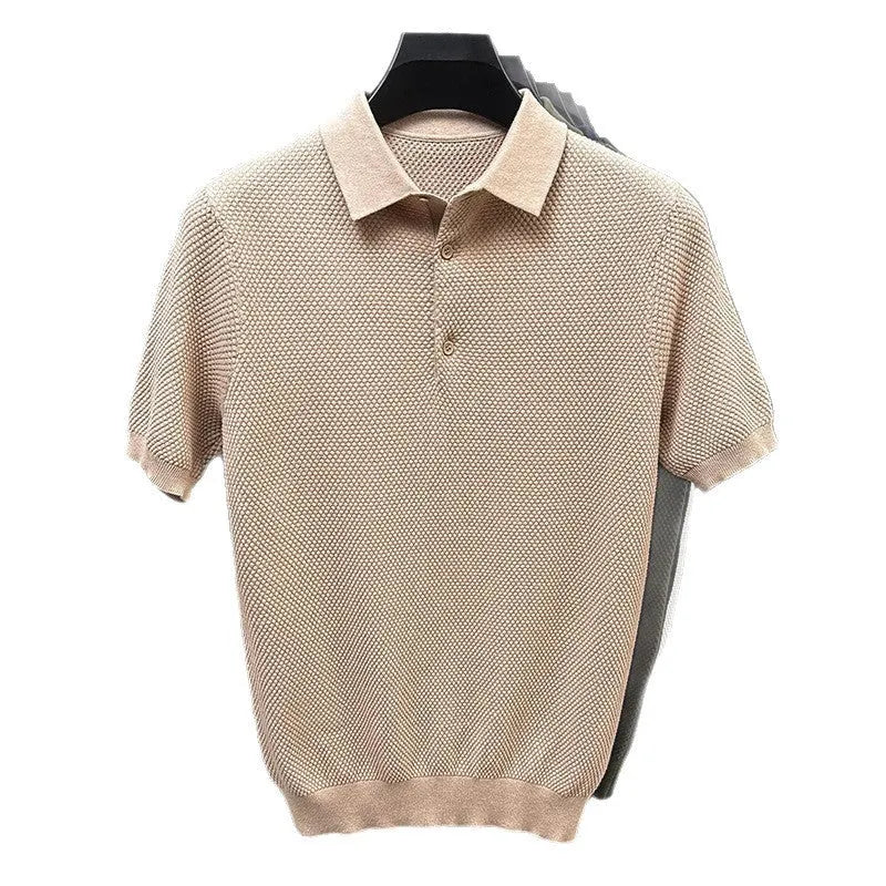 Man wearing a loose fit grey cotton short sleeve sweater, casual pullover style