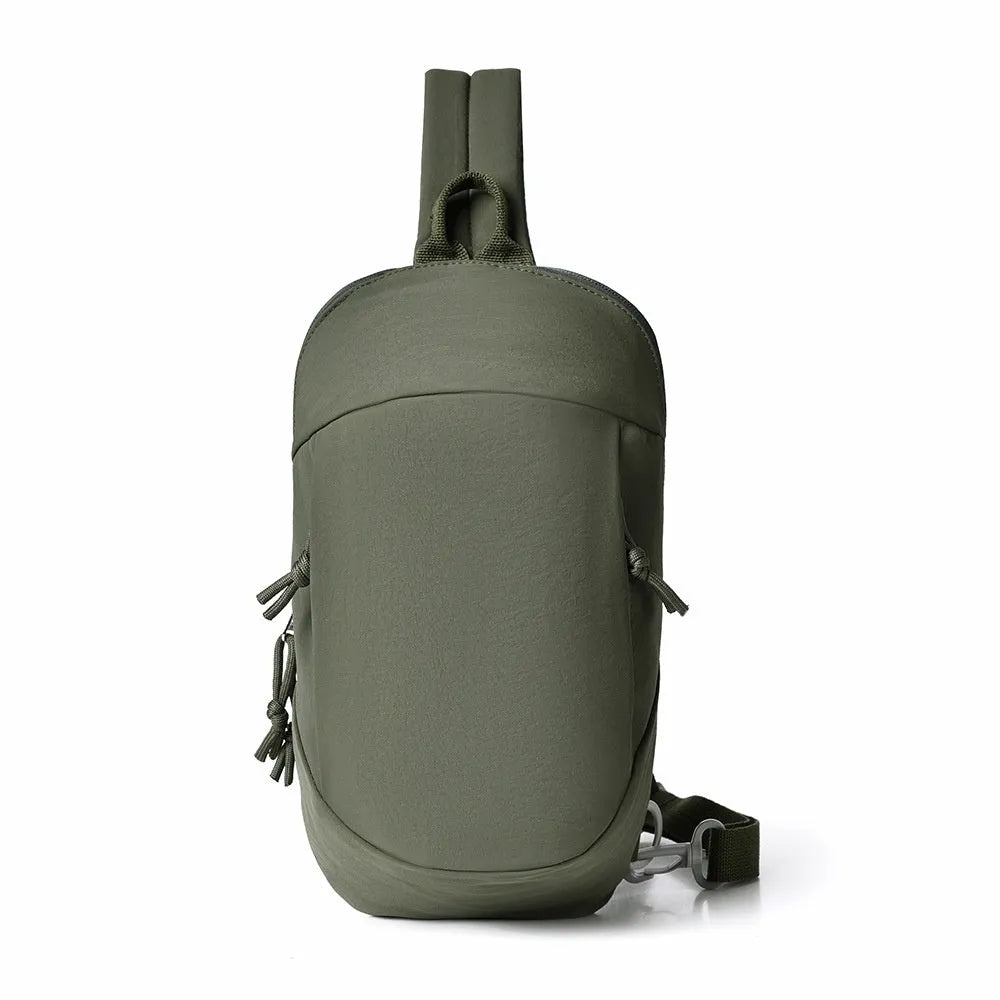 Outdoor nylon crossbody chest bag in army green colour showing single shoulder strap.