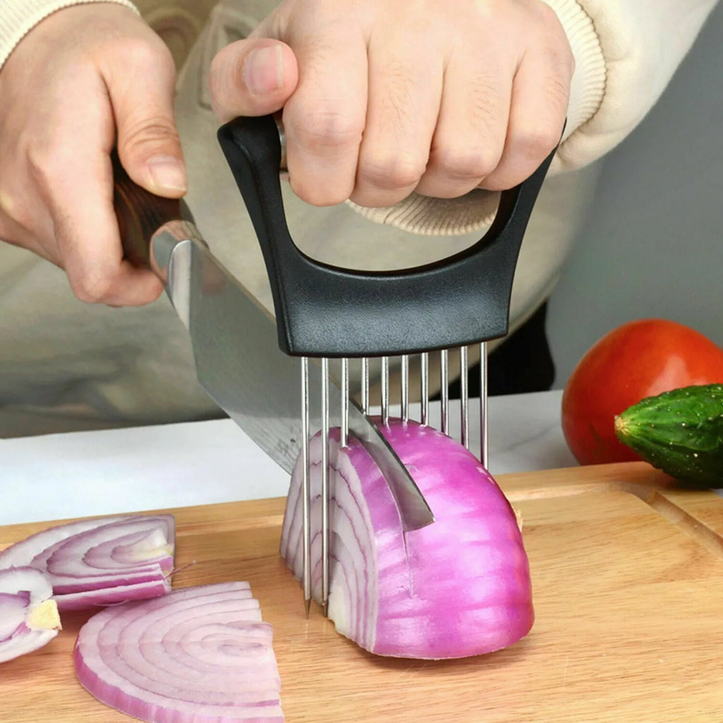Stainless steel onion holder and vegetable slicer tool with ABS handle on a kitchen counter.