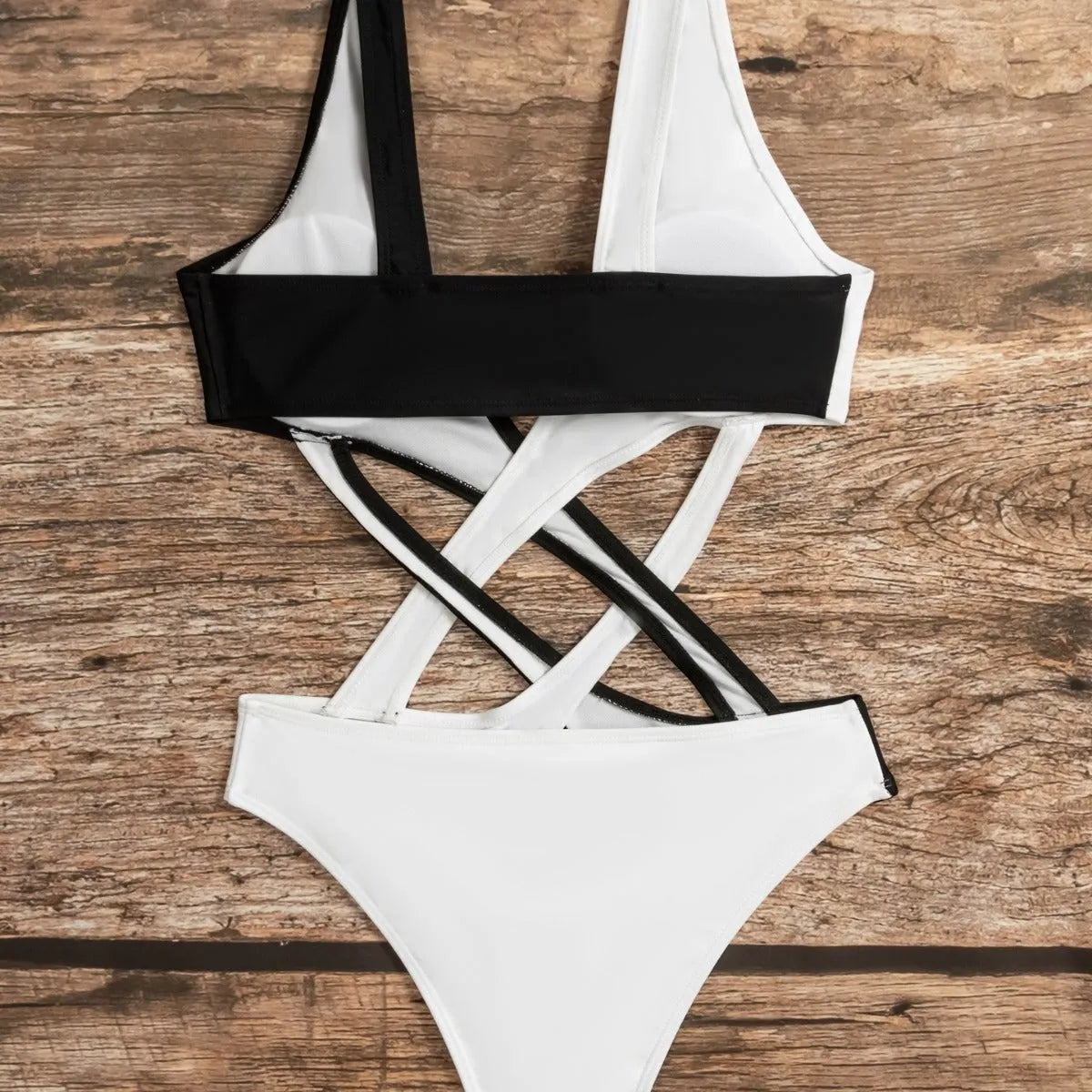 White women's one-piece swimsuit with colour-block pattern and hollow-out detailing