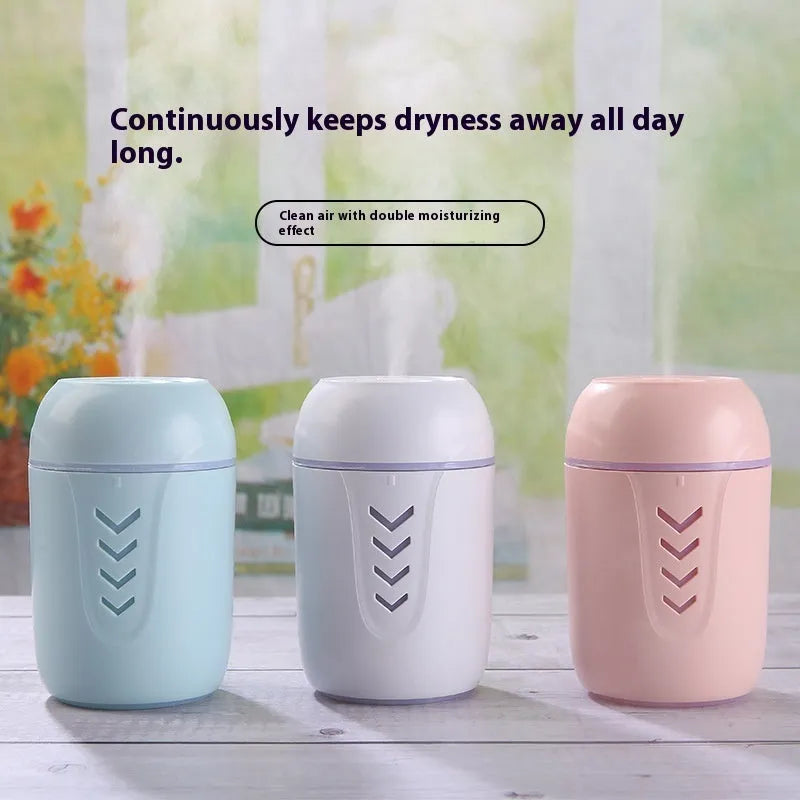 Small round portable air purifier in blue colour with USB cable for car or desktop use.