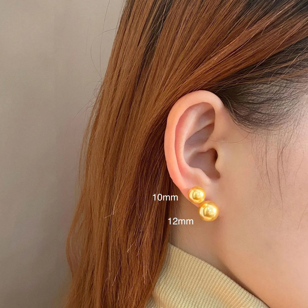 Retro-style geometric pearl stud earrings with star charms on silver settings