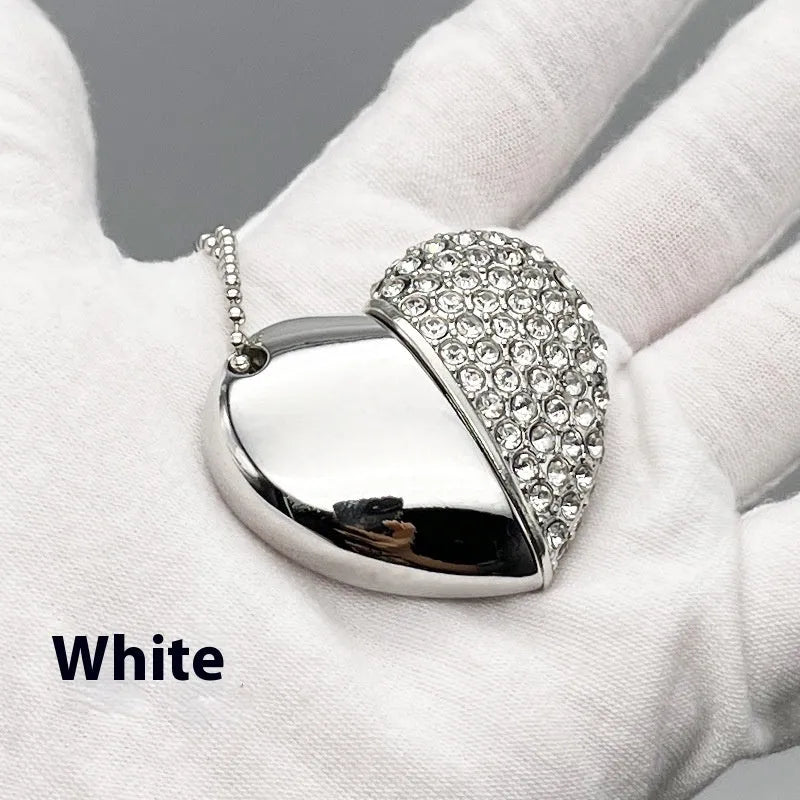 Blue metal USB flash drive with a brick-inlaid heart-shaped design, showing scale.