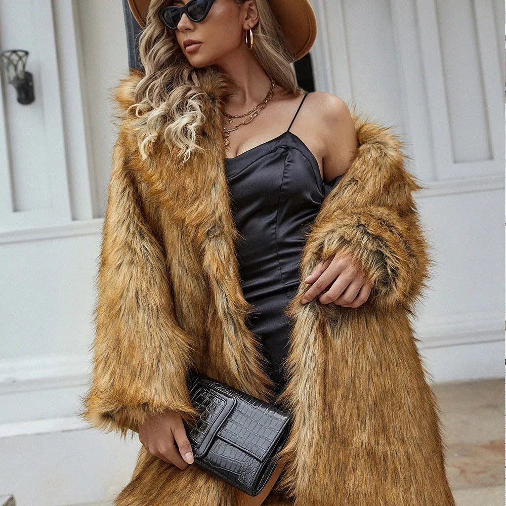 Yellow women's loose fit artificial fur coat with regular sleeves on hanger