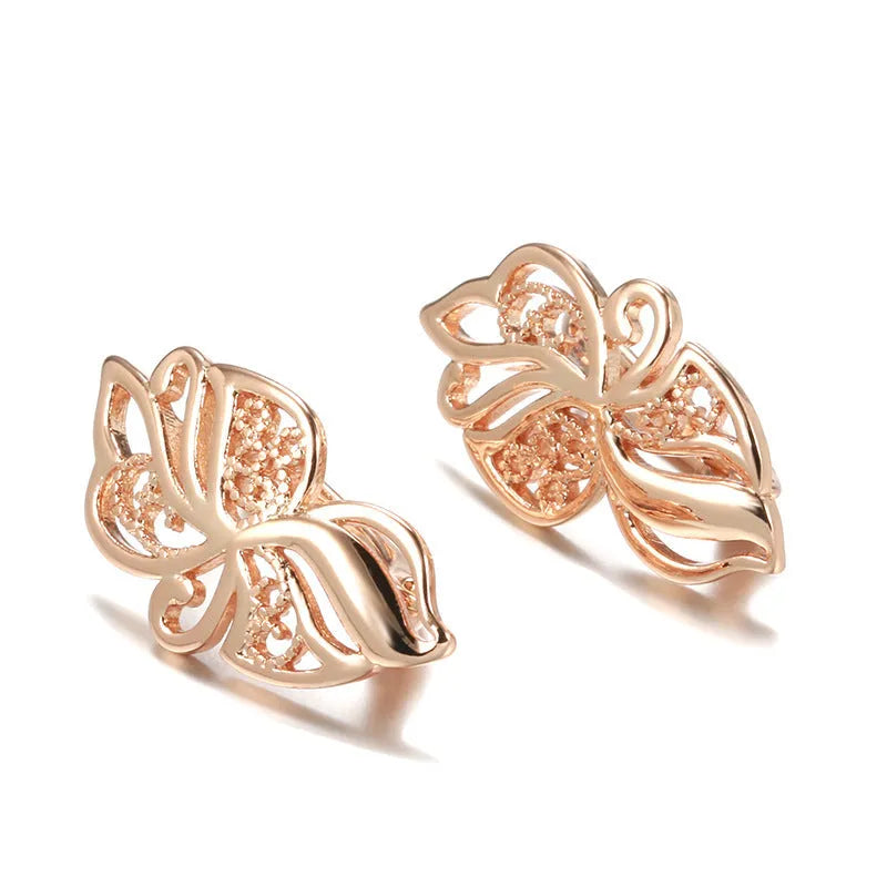 Rose gold copper earrings with hollow carved geometric design and rhinestone accents for women