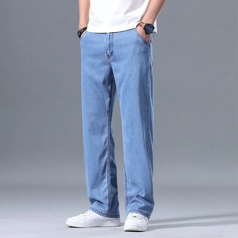 Men's loose straight-leg casual jeans in lyocell fabric, shown in light blue colour.