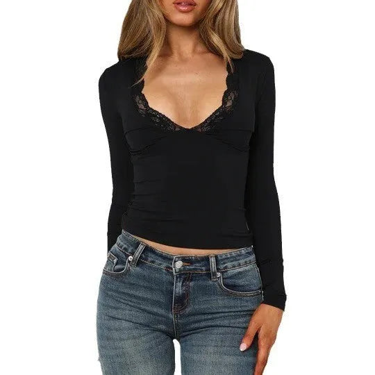 Women's slim fit black top with lace flower shoulder detail and long sleeves