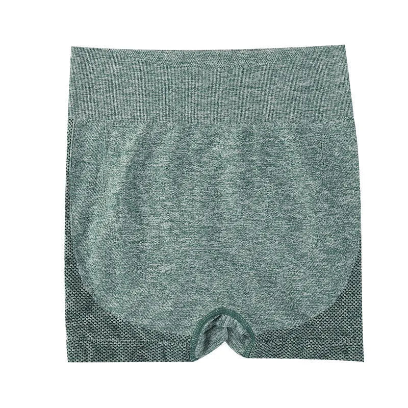 Women wearing high-waist seamless yoga shorts in black performing fitness exercises