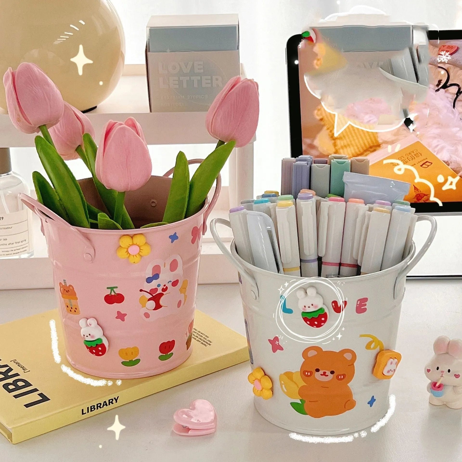 Round metal pen holder for desktop organisation, shown in available colour options including green, pink, and red.