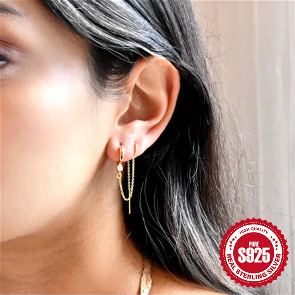 S925 sterling silver ear clip stud earrings with geometric flower design and golden electroplated tassel chain.