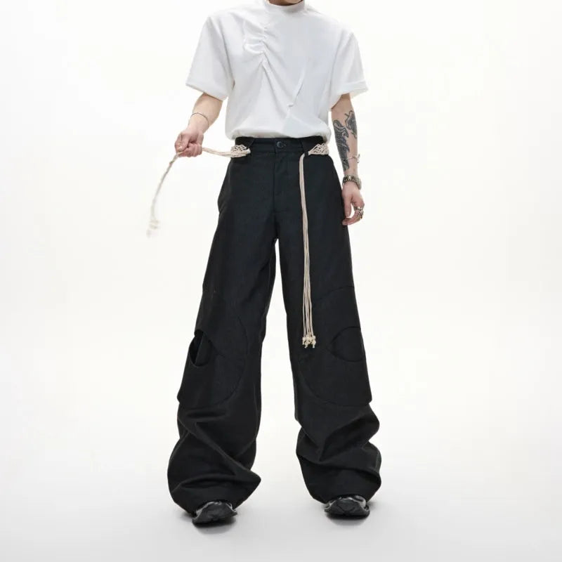 Men's heavyweight cotton straight-leg jeans with 3D cutting, decorative zipper details, and tassel accents in dark colours