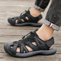 Men's blue outdoor sports shoes with velcro straps and a mesh upper on a rubber sole.