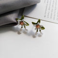 Sterling silver colour camellia flower earrings with needle studs and matching clip in contrast colours