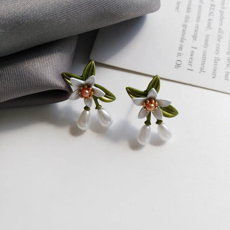 Sterling silver colour camellia flower earrings with needle studs and matching clip in contrast colours