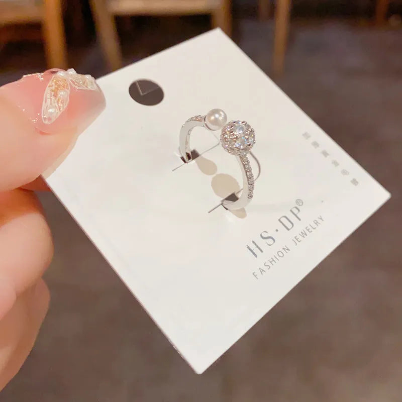 Open-end ring with round zircon stones in gold or silver plating