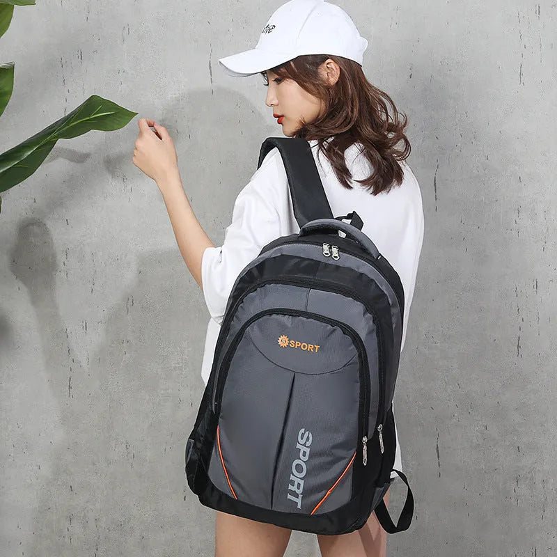 Men's large nylon backpack in black with curved shoulder straps and letter detailing, showing front and side views