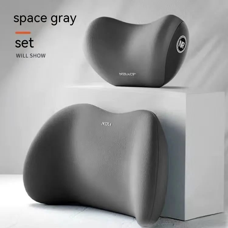 Black memory foam car lumbar support pillow and matching headrest on a car seat.