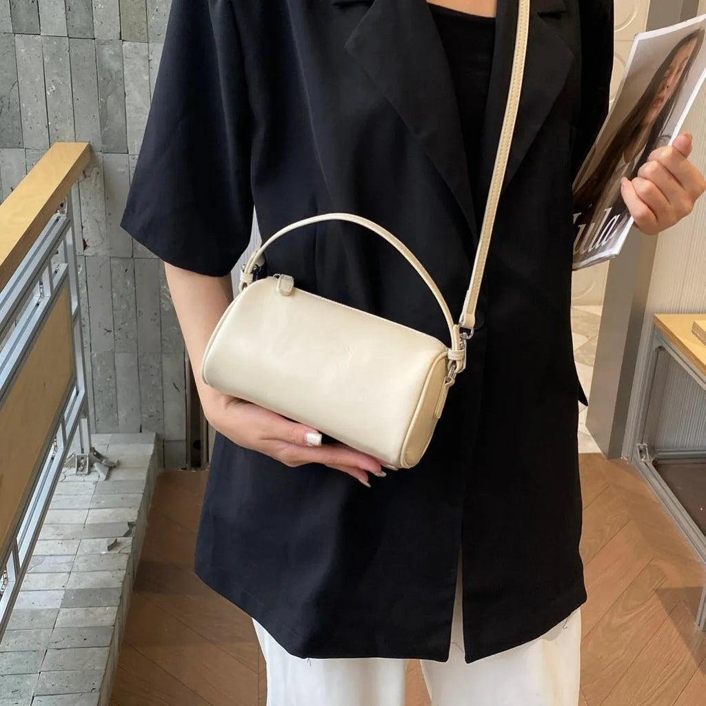 Soft vegetable tanning leather cylindrical crossbody phone bag in six colour options on a white background.