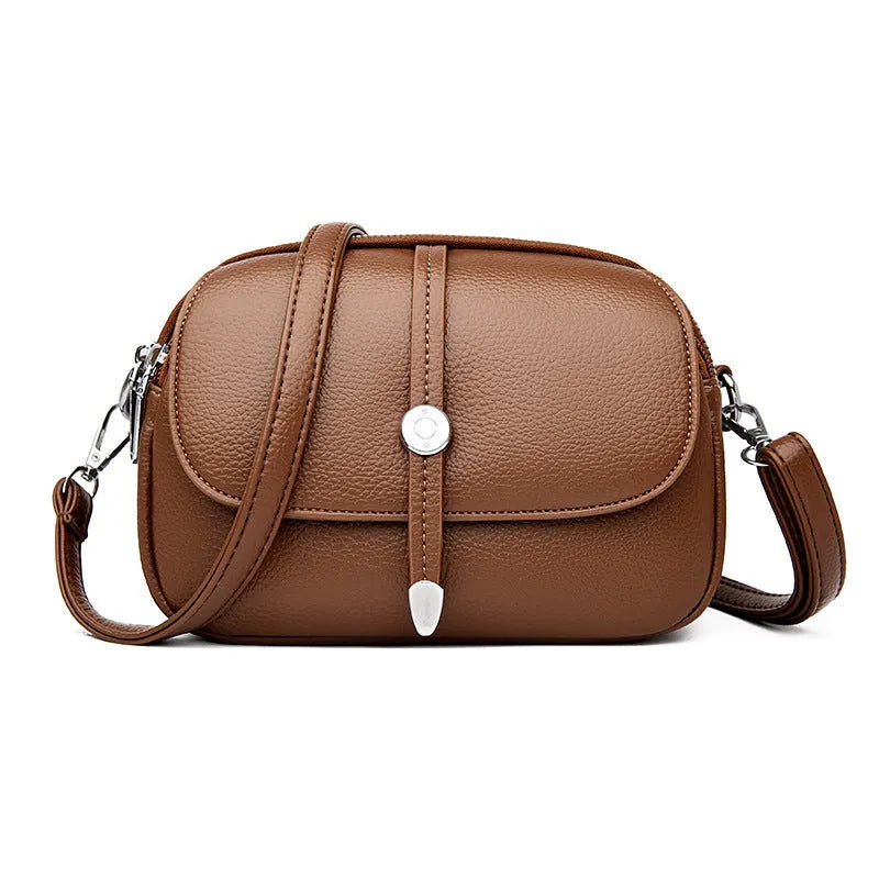 City Simple women's crossbody shoulder bag in soft PU leather with oval suitcase shape and sewing thread detailing
