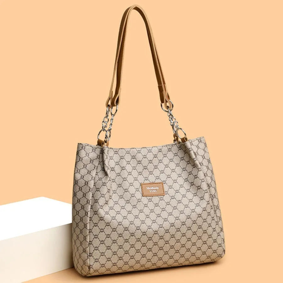 Women's retro style handbag in soft brown PU leather with a polyester lined interior.