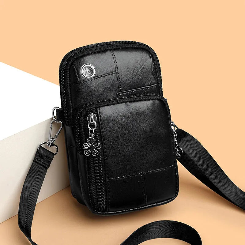 Vertical square mini mobile phone bag in PU leather with an exterior sandwich pocket.