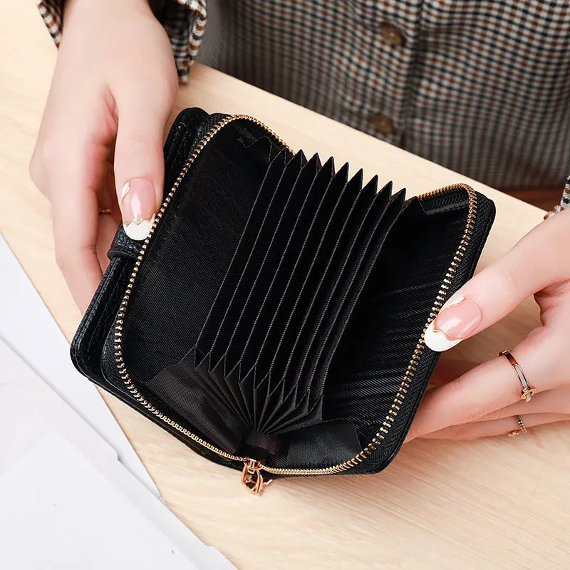 Ladies short wallet with lychee pattern in two-fold design, available in beige, pink, black, and red colours