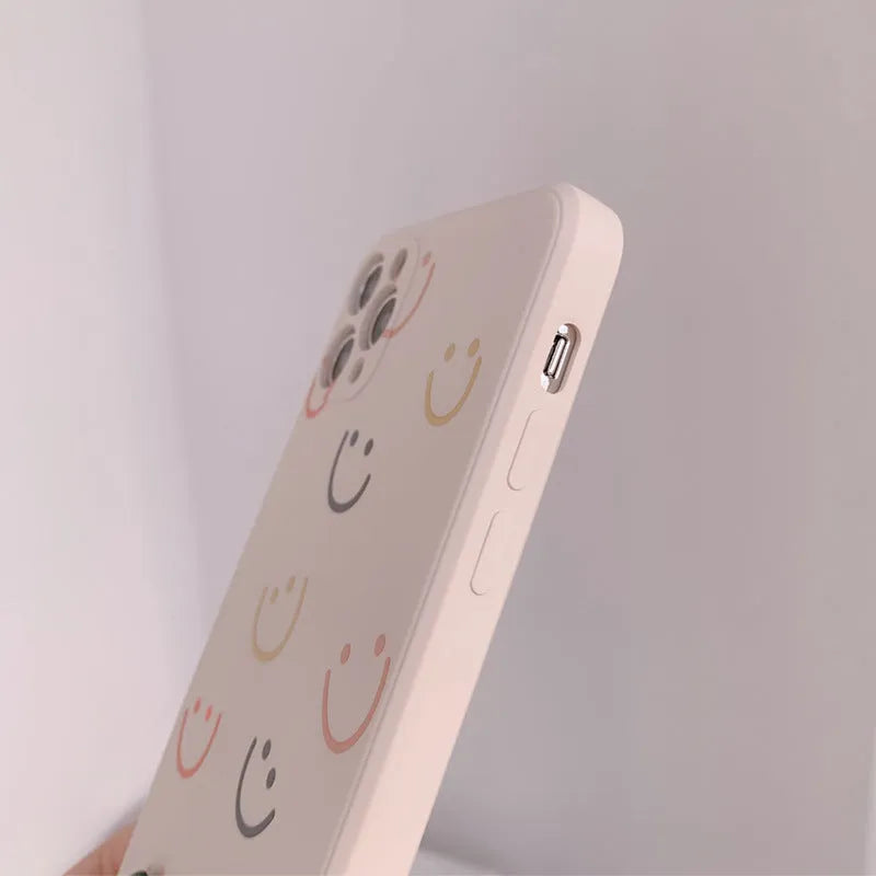 Simple silicone iPhone case with painted graffiti and stripe designs on a TPU back cover.