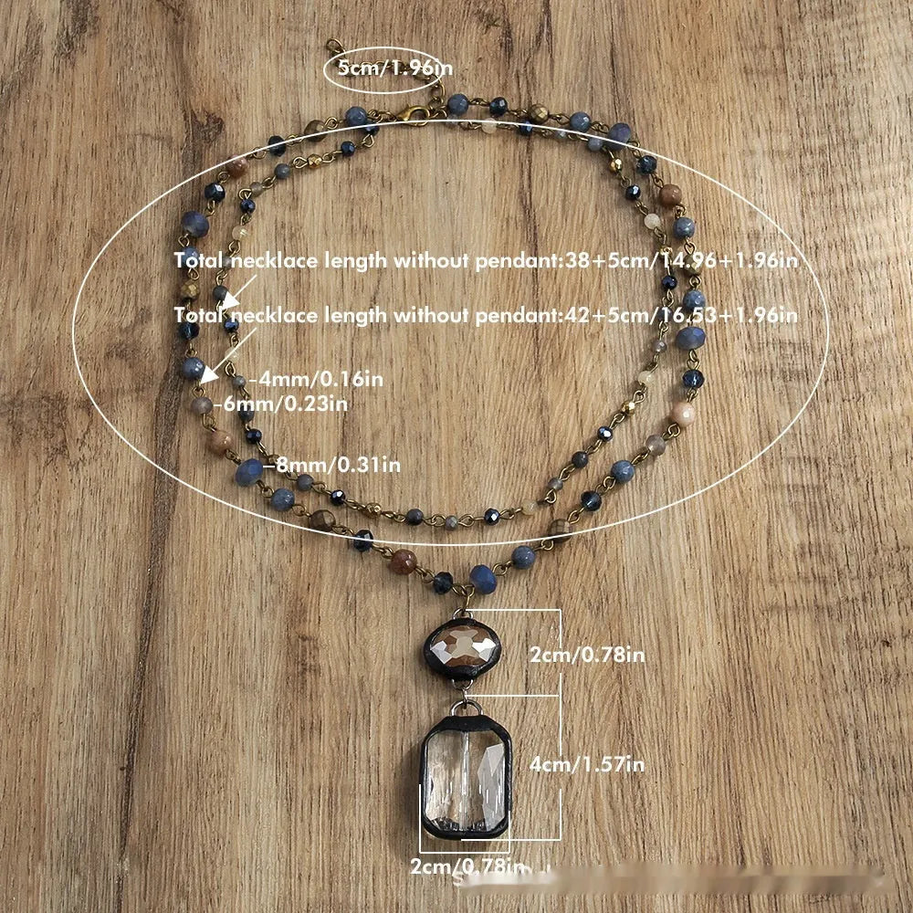 Beige and blue two-layer tribal style necklace with glass pendant and stone accents on adjustable chain