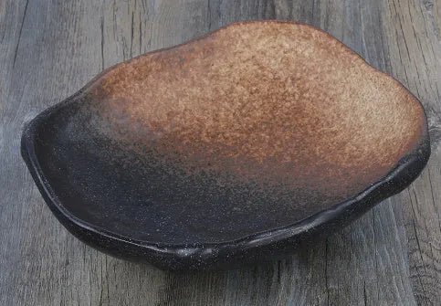 Creative Japanese style coarse pottery bowl with irregular shape and floral decorations