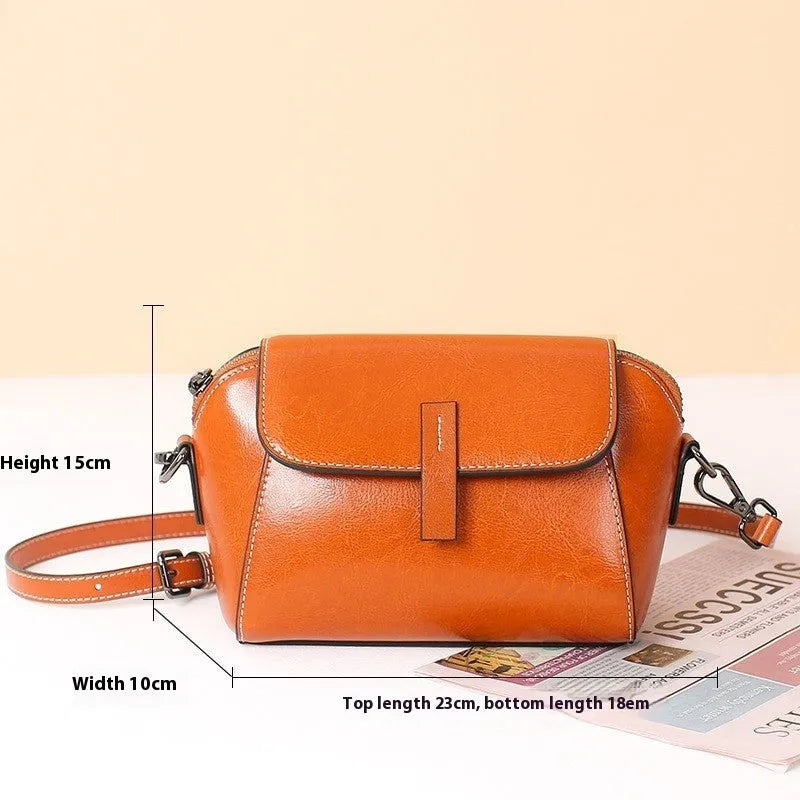 Women's soft oil wax cowhide shell messenger bag in avocado green with cross-body strap and visible stitching