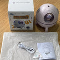 Light purple astronaut-shaped desktop humidifier with LED lights and USB cable