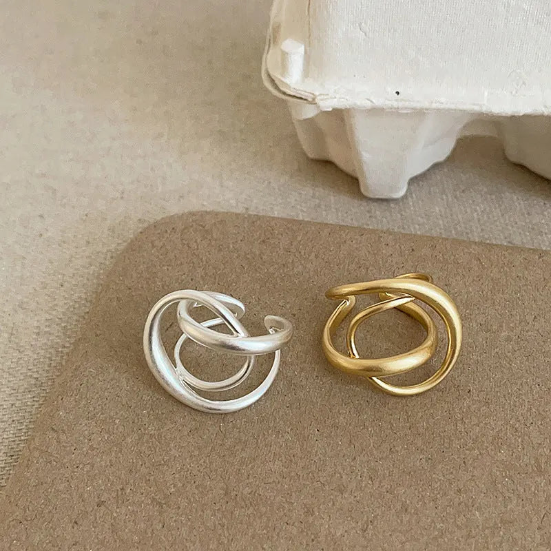 Three-dimensional interlaced geometric adjustable ring with matte metal finish and real gold electroplating