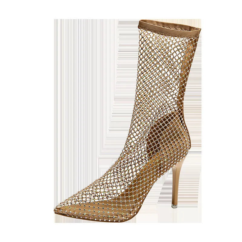 Gold women's high heel sandals with mesh upper, pointed toe, and stiletto heel on a rubber sole.