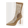 Gold women's high heel sandals with mesh upper, pointed toe, and stiletto heel on a rubber sole.