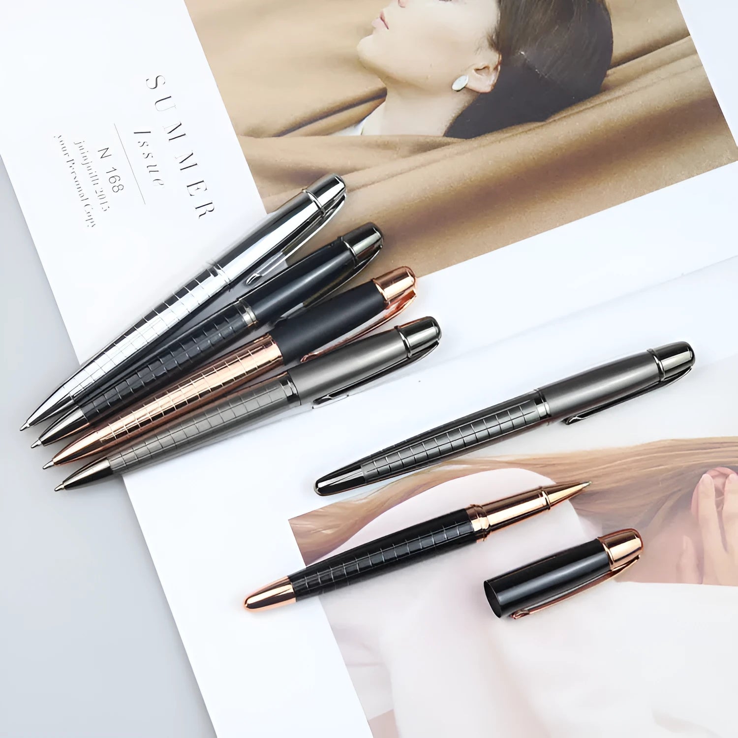 Gun grey metal rollerball pen shown with black and blue ink refill options