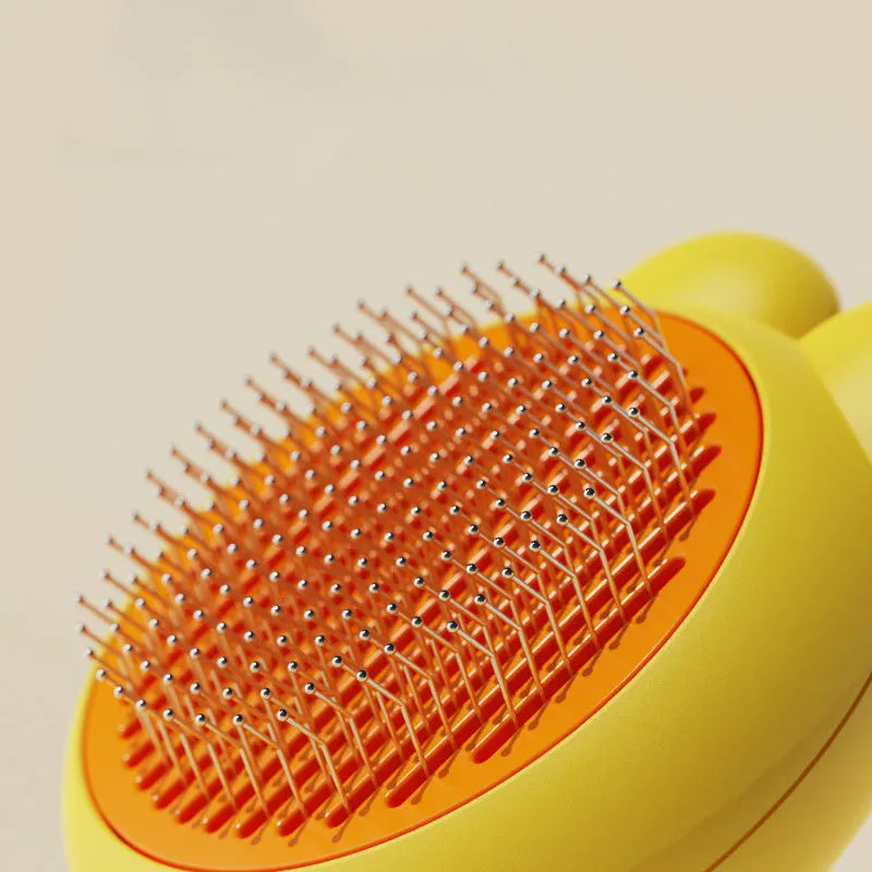 Self-cleaning pet grooming brush with release button in four colour options